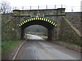 Low railway bridge crossing Cocking Hill