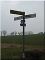 TM2585 : Roadsign on Church Lane by Geographer