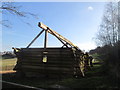 Log cabin under construction at Clifton