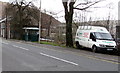 White van and dark green bus shelter in Llwynypia