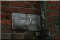 Dairy equipment advertising plate on farm building in South Kelsey North End