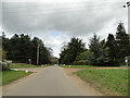 Sandy Lane on the left and a sandy lane on the right