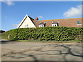 High hedge hiding Well Cottage