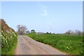 Ridge Road and two-blade wind turbine near Weeke Cross