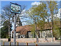 The village sign and church at Upchurch