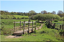 TQ7610 : Footbridges at Combe Valley Countryside Park by Oast House Archive
