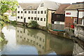 View of the rear of shops backing onto the River Lea from Mill Bridge