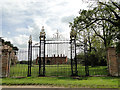 Ampton Hall through the park gates