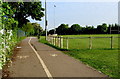 Separate lanes for cyclists and walkers on a path past Little Stoke Park Recreation Ground