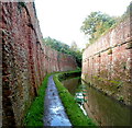 Canal and muddy path between high walls, Bridgwater