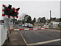 Red lights flashing, barriers down at Ammanford station level crossing