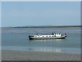 TQ9765 : Boat on the Swale by Chris Whippet