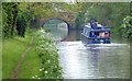 Narrowboat approaching Caves Bridge