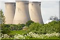 Small house, giant cooling towers