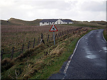 NF6905 : Barra airfield warning sign by John Lucas