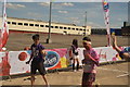 View of the first of the Colour Runners crossing the finish line