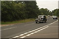 View of a Lea-Francis 14hp passing along London Road as part of the London-Southend Classic Car Run