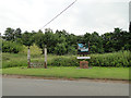 The stocks and village sign at Haveringland