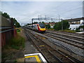 A Pendolino passes South Kenton station