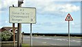 J5976 : Faded and patched road sign, Millisle (July 2015) by Albert Bridge