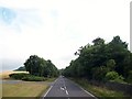 The A24 running southwards alongside the park wall of Seaforde House