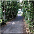 SS9082 : Road narrows sign and speed bump near Pen-y-fai by Jaggery
