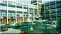 Offices and car park from railway south of Cheadle Hulme Station