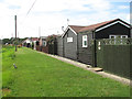 TG4117 : Bungalows beside the River Thurne by Evelyn Simak
