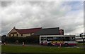 The Winter Stream Farm public house and a bus