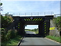 Low railway bridge crossing Froghall Road