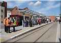 Waiting for a tram at Beeston Centre on opening day