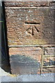 Benchmark on Stricklandgate wall at Christ Church entrance