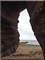 SX9777 : Looking out of the natural arch, Langstone Cliff by David Smith