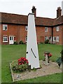 Boxed in village pump at Boyton Almshouses