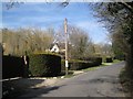 Large detached houses and gardens on the west side of New Road Hill, Woolhampton