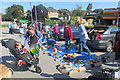 Toys for the children on a mat at a charity car boot sale