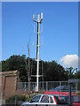 Mobile phone mast beside trees