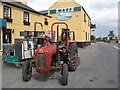 L6244 : Tractor at Keogh's Store by Jonathan Wilkins
