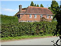 House on Mill Lane seen from footpath junction