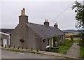 NJ8009 : A pair of semi-detached Auchronie Cottages by Stanley Howe