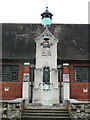 Clock and statue on St Edith