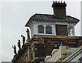 Statues on the roof of the former Hughes and Mullins store on Union Street Ryde