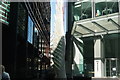 View of stripes from 60 Threadneedle Street reflected onto a sculpture of a feather #2