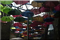 View of a canopy of colourful umbrellas in Vinopolis Piazza