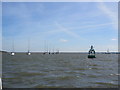 TQ7869 : Gillingham Reach marker buoy and moored boats by David Anstiss