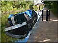 Burnt out narrowboat on the Birmingham & Fazeley Canal