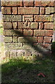 Benchmark on back of pillar box, Rugby Road