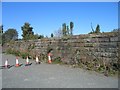 Remains of reservoir wall at Hilltop Heights