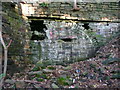 Arch in retaining wall and cavity under Boothroyd Lane, Rastrick