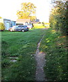 Track between houses and a school, Rogiet